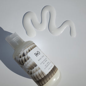 R+Co Ring Tone on bathroom shelf with toiletries showing daily styling convenience and style