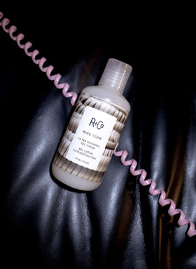 R+Co 177 ml jar held in hand illustrating real size and travel-friendly packaging benefit