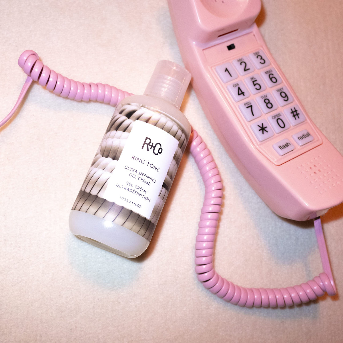 R+Co gel-crème texture close-up demonstrating smooth slip and styling consistency for curls