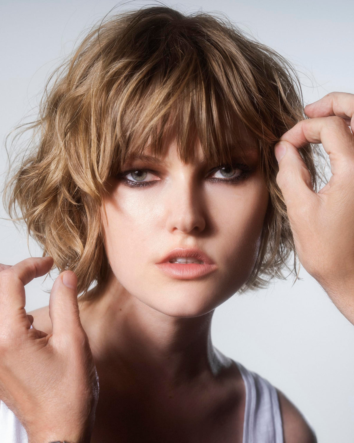 R+Co SUN CATCHER being applied to hair to protect and refresh style instantly