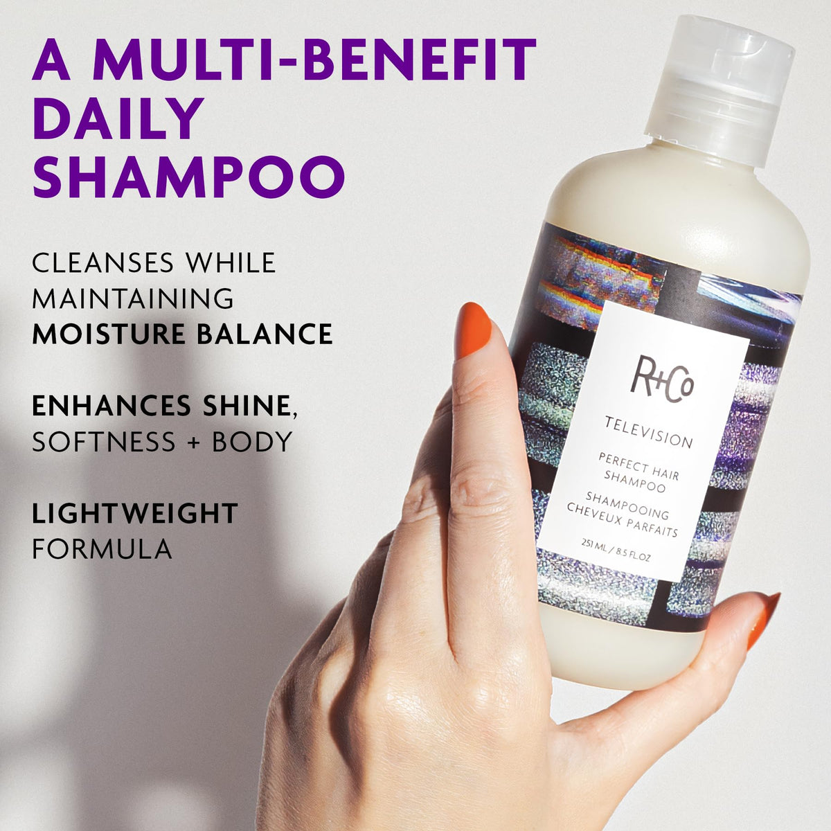 R+Co botanicals display with juniper and marigold highlighting scalp-care benefit