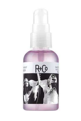 R+Co front bottle of Two Way Mirror showing sleek packaging and brand polish