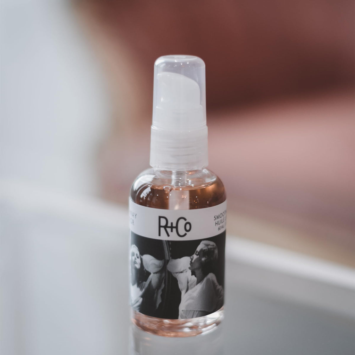 R+Co pump dispensing Two Way Mirror oil with controlled pour for easy dosing