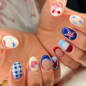 Rdntbeu front box view showcasing 4th of July nails and included tools for convenience