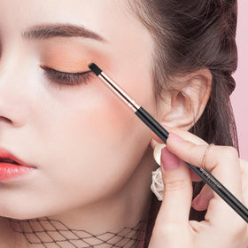 Real Perfection brush set held in hand to show scale and travel convenience