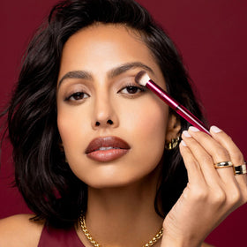 Real Techniques 103 Pop Shadow brush pressing eyeshadow to show strong pigment packing benefit