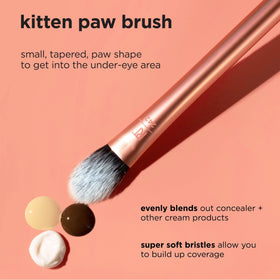 Real Techniques brush in hand demonstrates compact size and travel-friendly scale