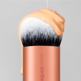 Real Techniques brush in a travel pouch portraying portability and everyday convenience