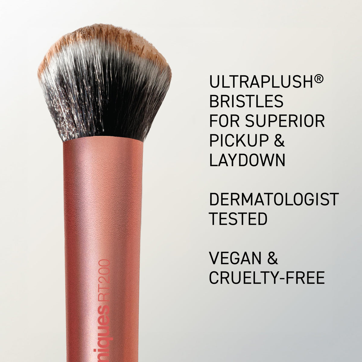 Real Techniques brush in use blending foundation on cheek benefit: streak-free finish