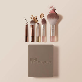 Real Techniques applying eyeshadow with mini brush demonstrating precise blending control