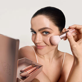 Real Techniques compact mirror open beside brushes for on-the-go precision and quick touch-ups