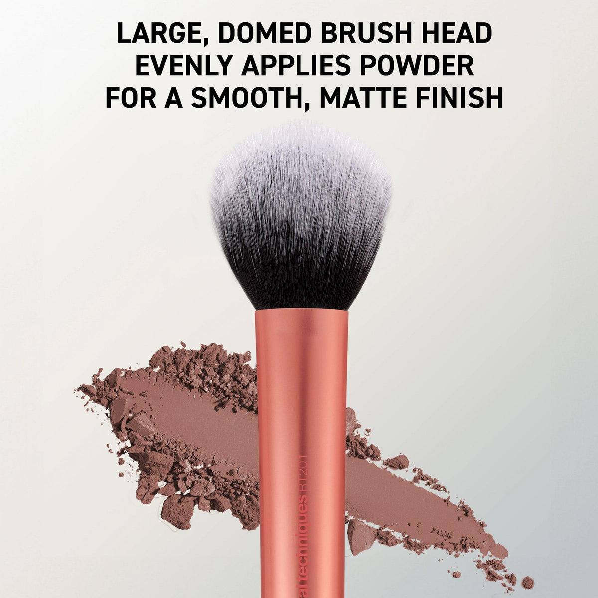 Real Techniques brush in use applying setting powder for a smooth, mattified finish