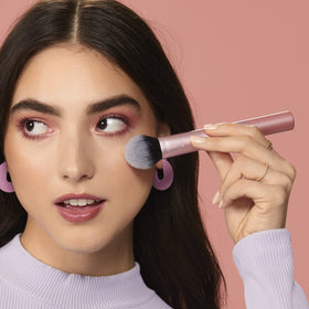 Real Techniques RT 449 applying blush in use for lifted, blended cheek color