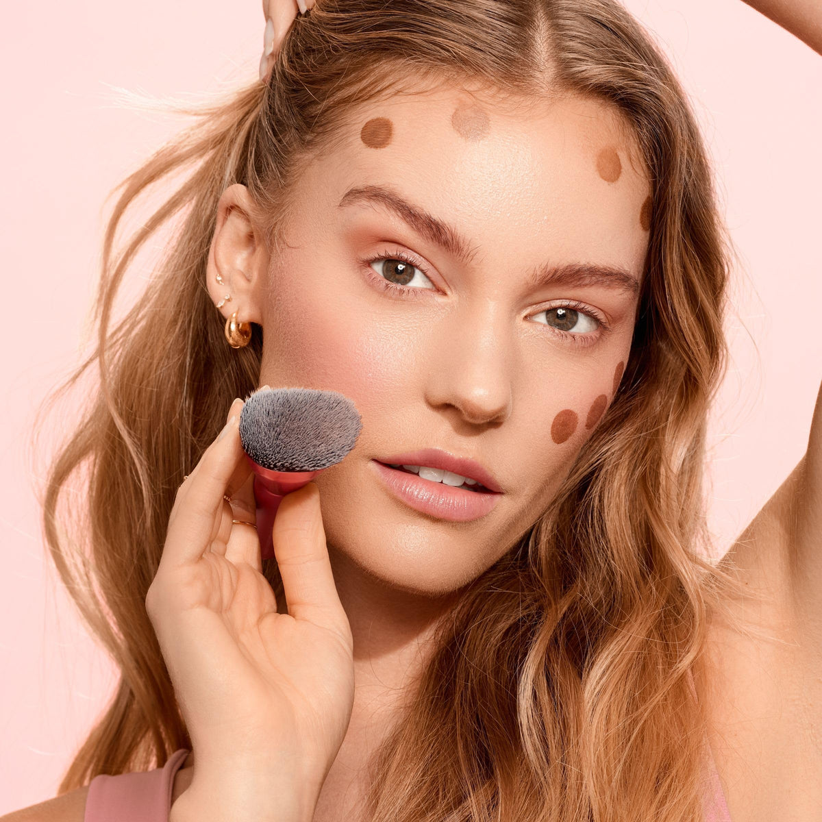 Real Techniques brush applying liquid cream contour for seamless placement