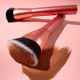 Real Techniques brush blending powder to diffuse harsh lines and soften finish