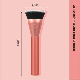 Real Techniques brush held in hand showing size and control benefit