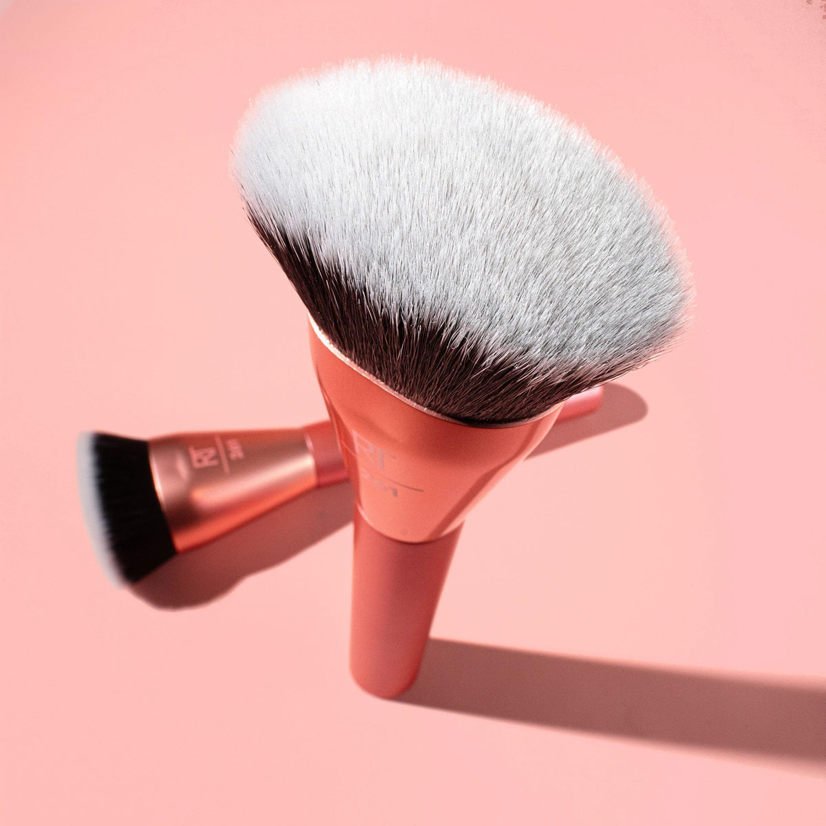 Real Techniques brush with packaging in a vanity setting showing gift-ready appeal