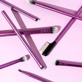 Real Techniques brushes packed in a travel pouch ready for on-the-go touch-ups and convenient storage