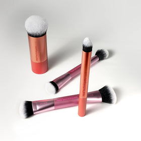 Real Techniques brush set with travel pouch showing compact size for easy packing