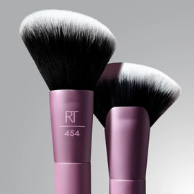 Real Techniques brush with cream contour on bristles showing product pickup and even laydown benefit