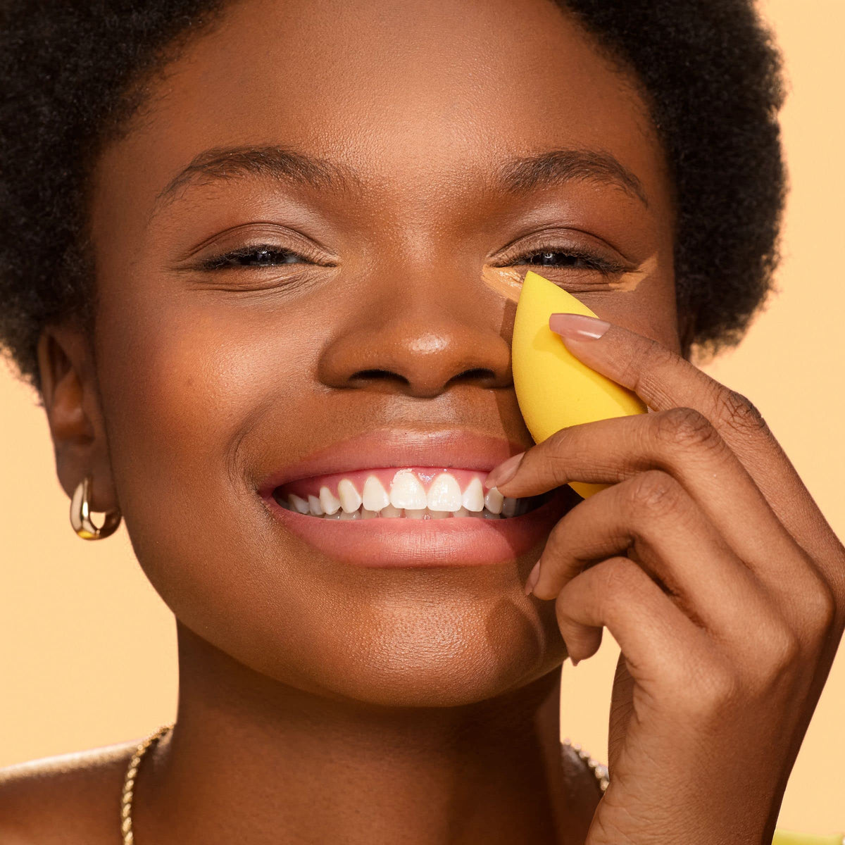 Real Techniques sponge next to liquid concealer for ideal pairing