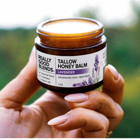 Really Good Blends balm being smoothed on hand demonstrating quick absorption benefit