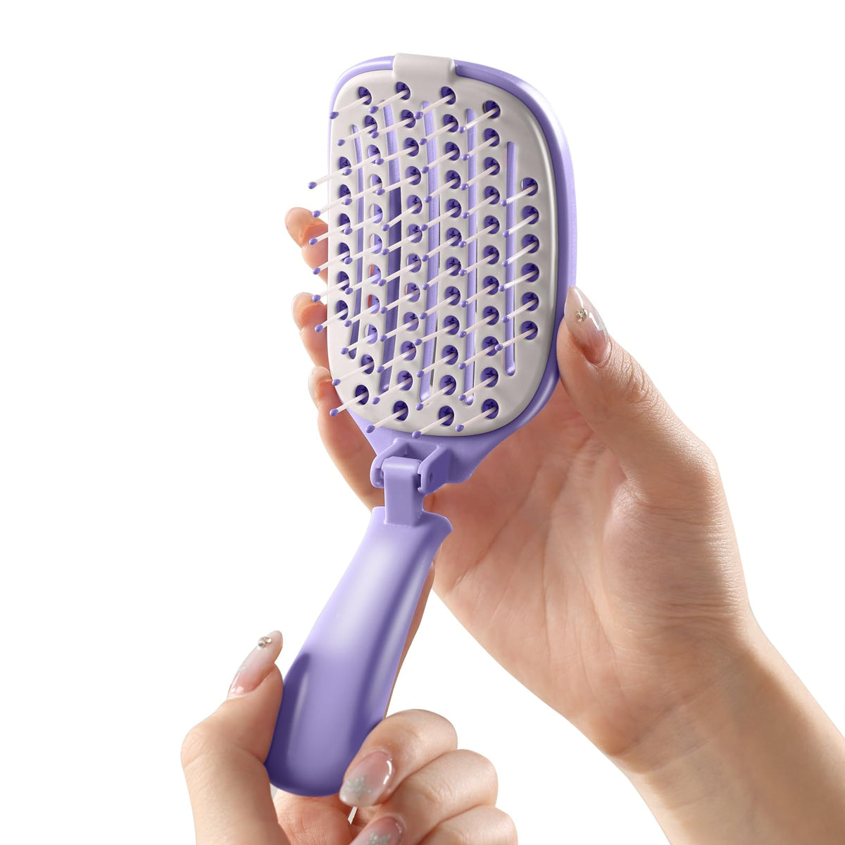 Rebex front view of purple brush showing compact travel-ready design and convenience