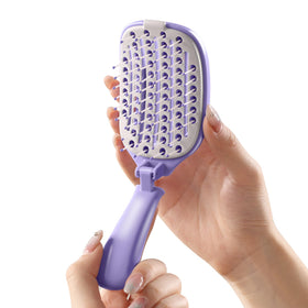 Rebex front view of purple brush showing compact travel-ready design and convenience