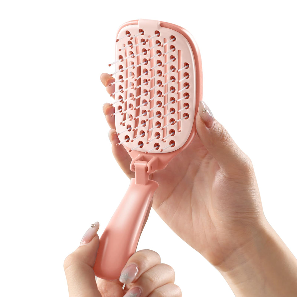 Rebex brush front view showing pink travel-friendly design and portable benefit