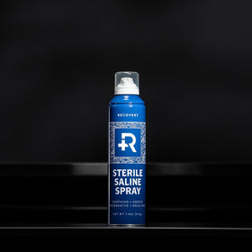 Recovery Aftercare used on ear piercing illustrating no-touch gentle cleansing benefit