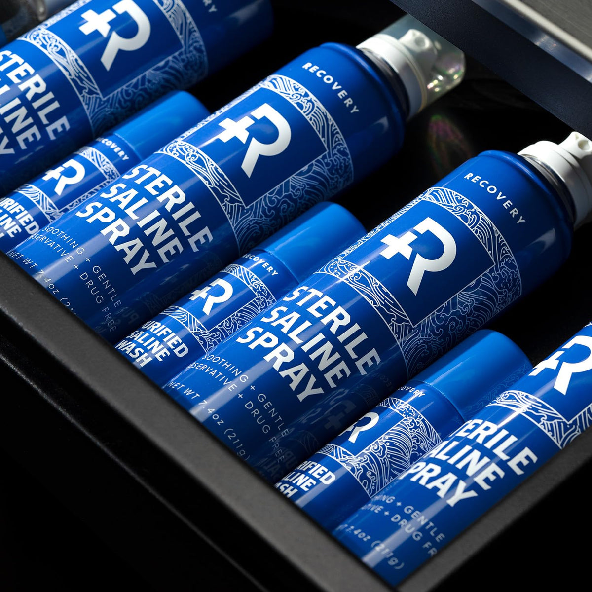 Recovery Aftercare spray mist cloud showing fine saline texture and gentle rinse