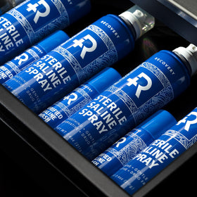 Recovery Aftercare spray mist cloud showing fine saline texture and gentle rinse