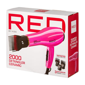 RED by KISS held next to a hand to show lightweight size and travel-friendly design
