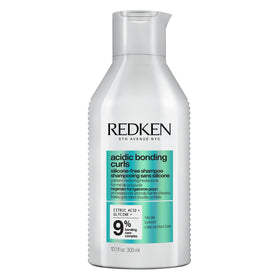 Redken front bottle showing branding and curl-focused formula benefits