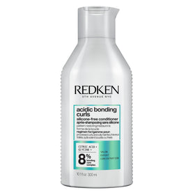 Redken front packaging showing conditioner and clear benefit of curl repair