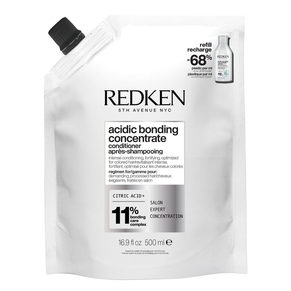 Redken front packaging shows label and benefits for strength repair