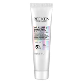 Redken bottle front packaging showing product name and benefit