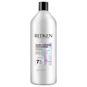 Redken bottle front packaging showing product and benefits