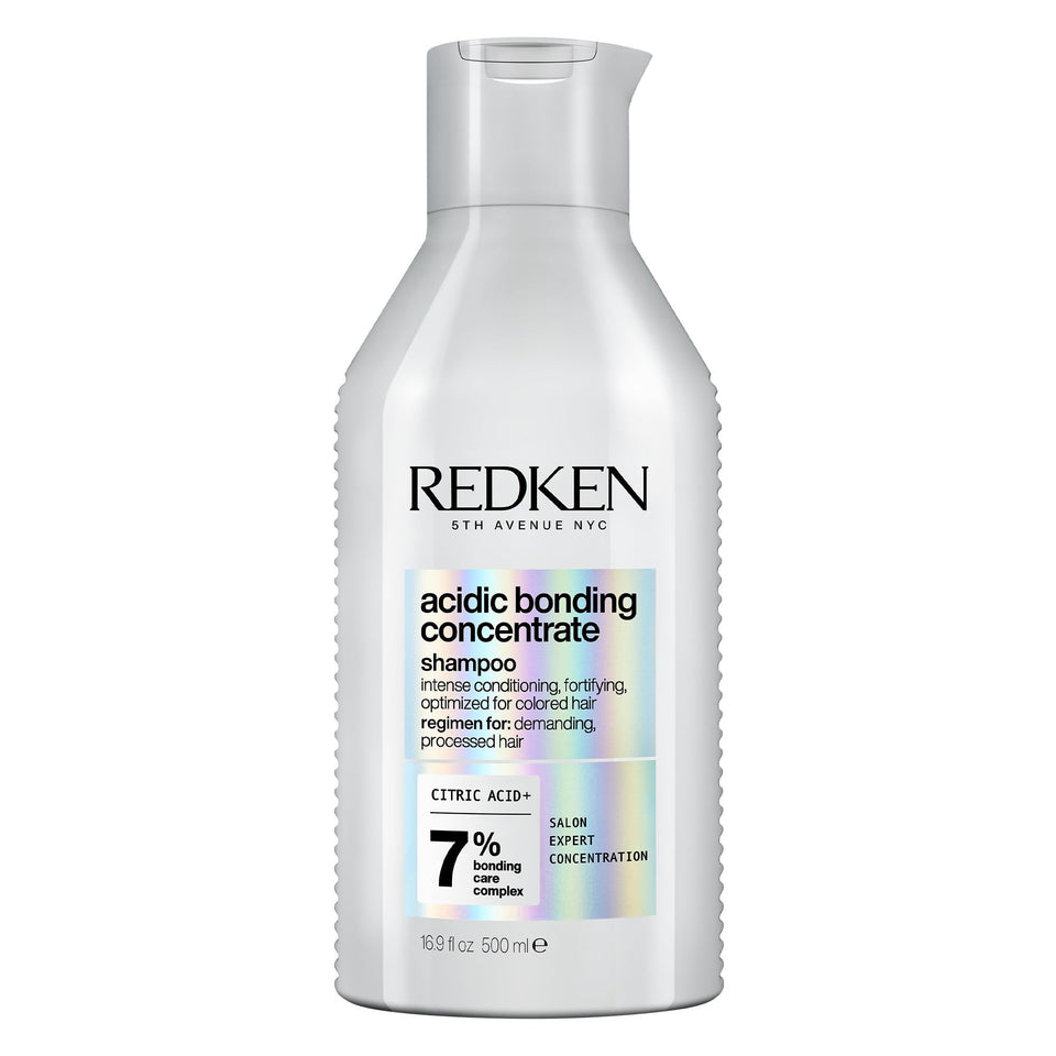 Redken bottle front view showing product and strength-repair benefit