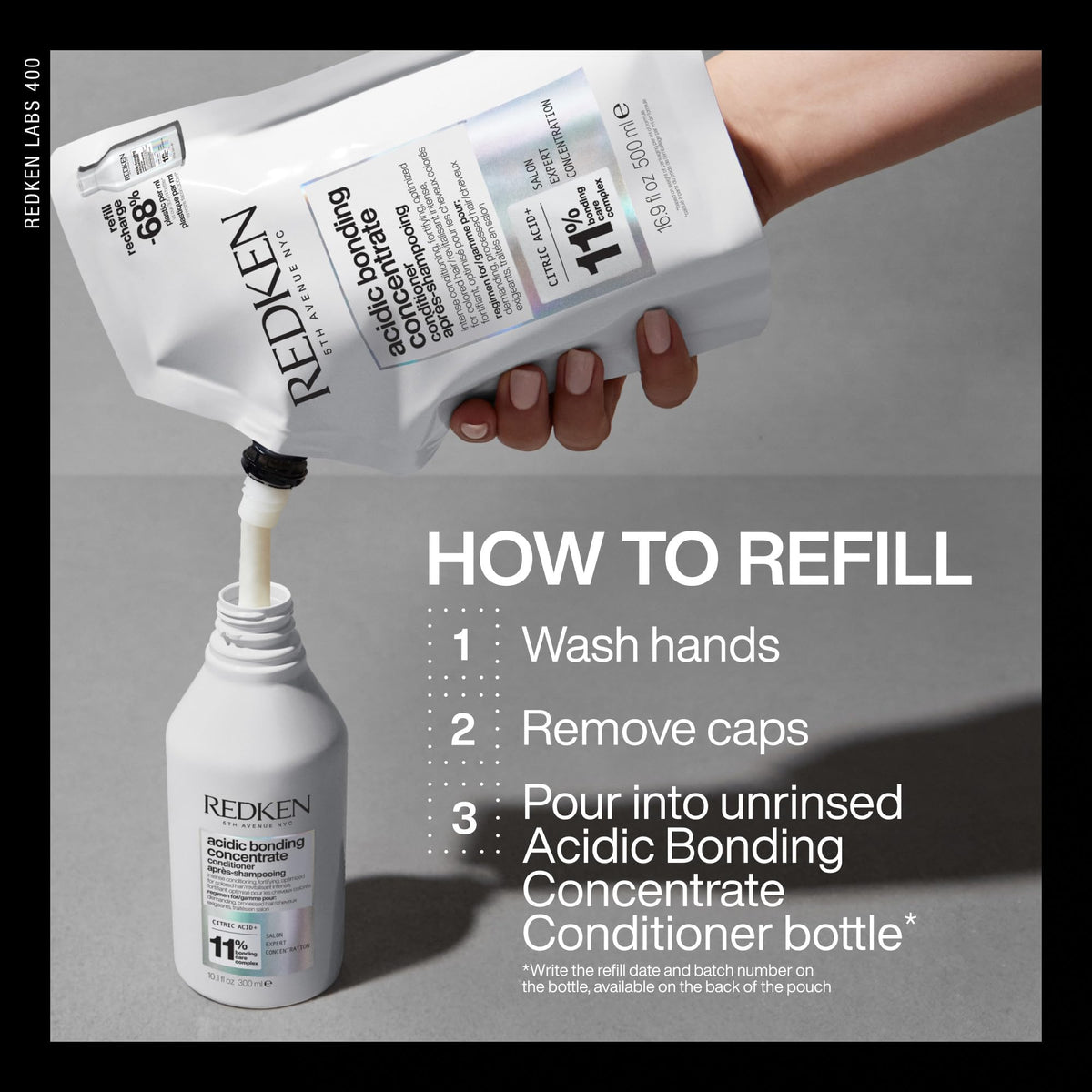 Redken bottle in hand for scale showing travel-friendly size