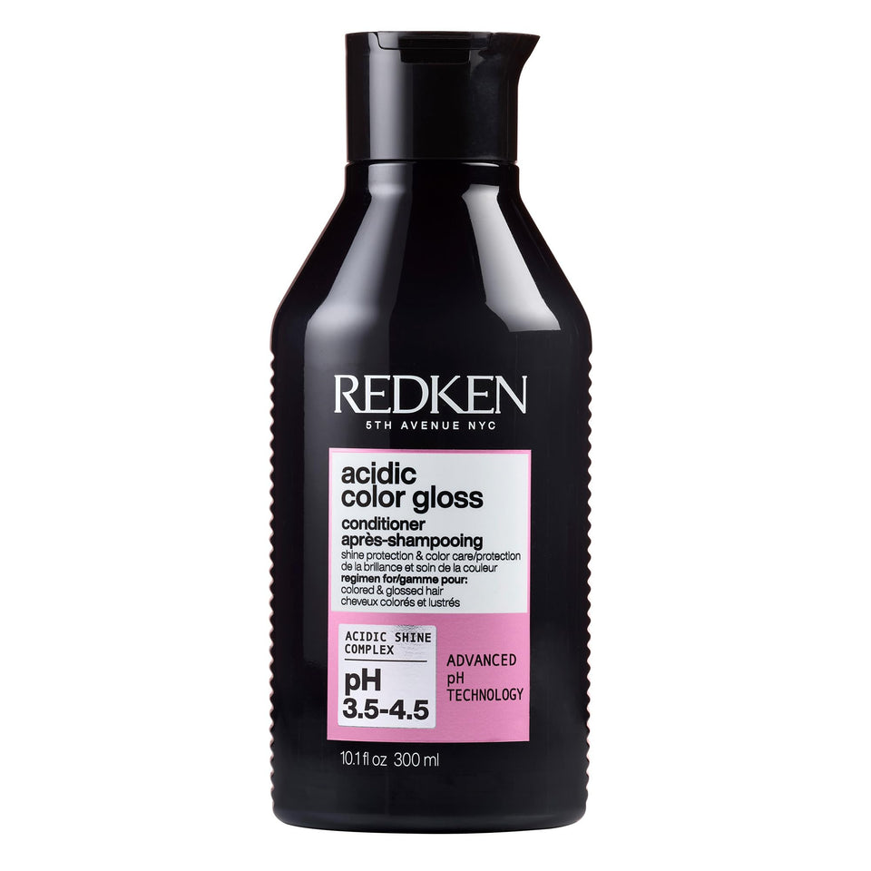 Redken front bottle view showing product and clear benefit of color protection