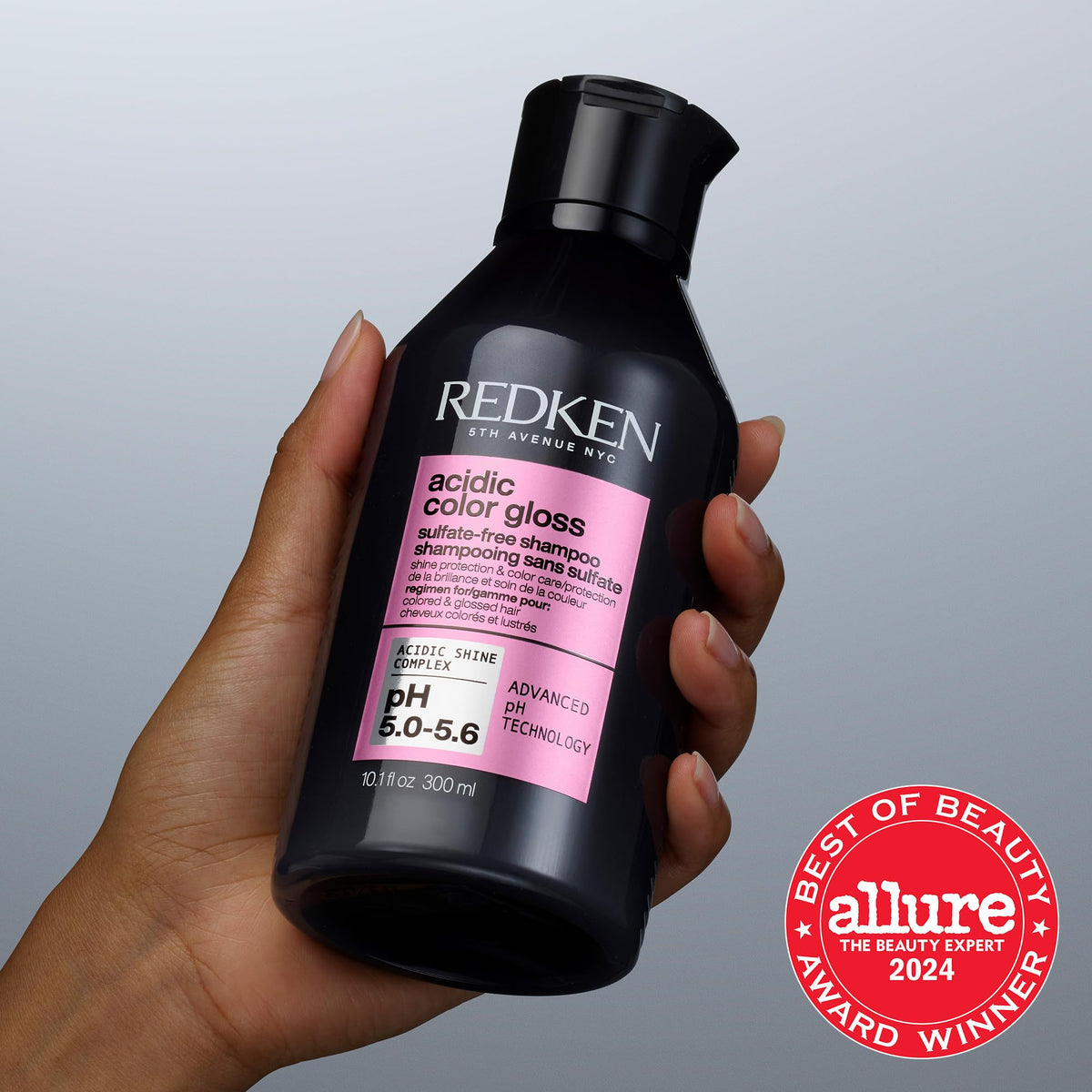 Redken bottle staged in bathroom emphasizing daily routine benefit