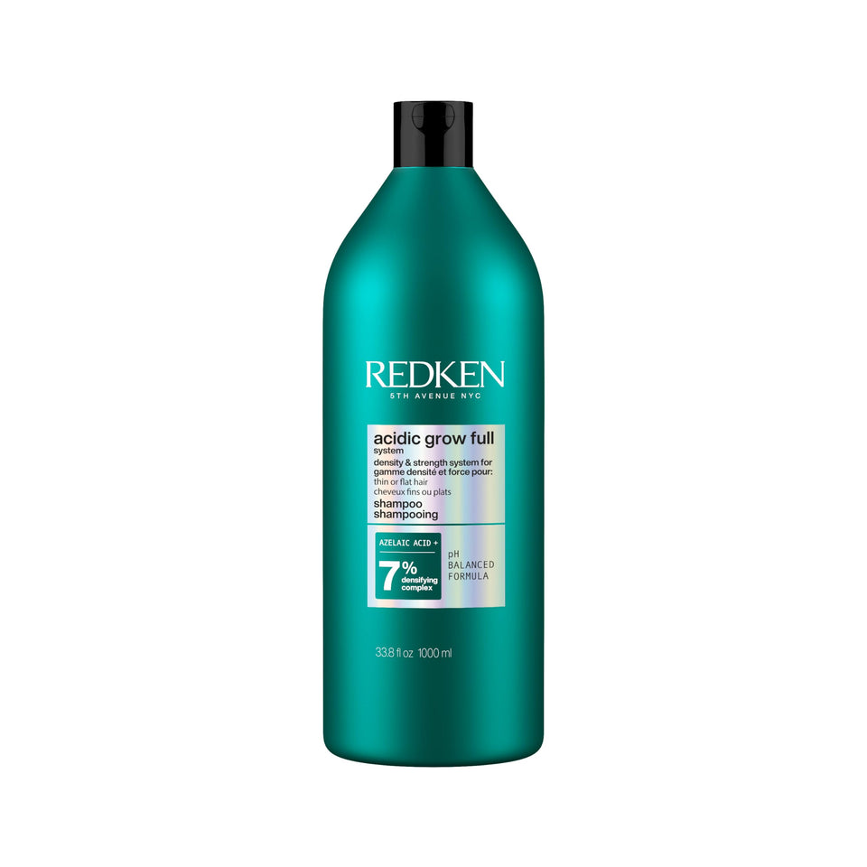 Redken bottle front view showing label and 33.8 fl oz, promotes fuller-looking hair