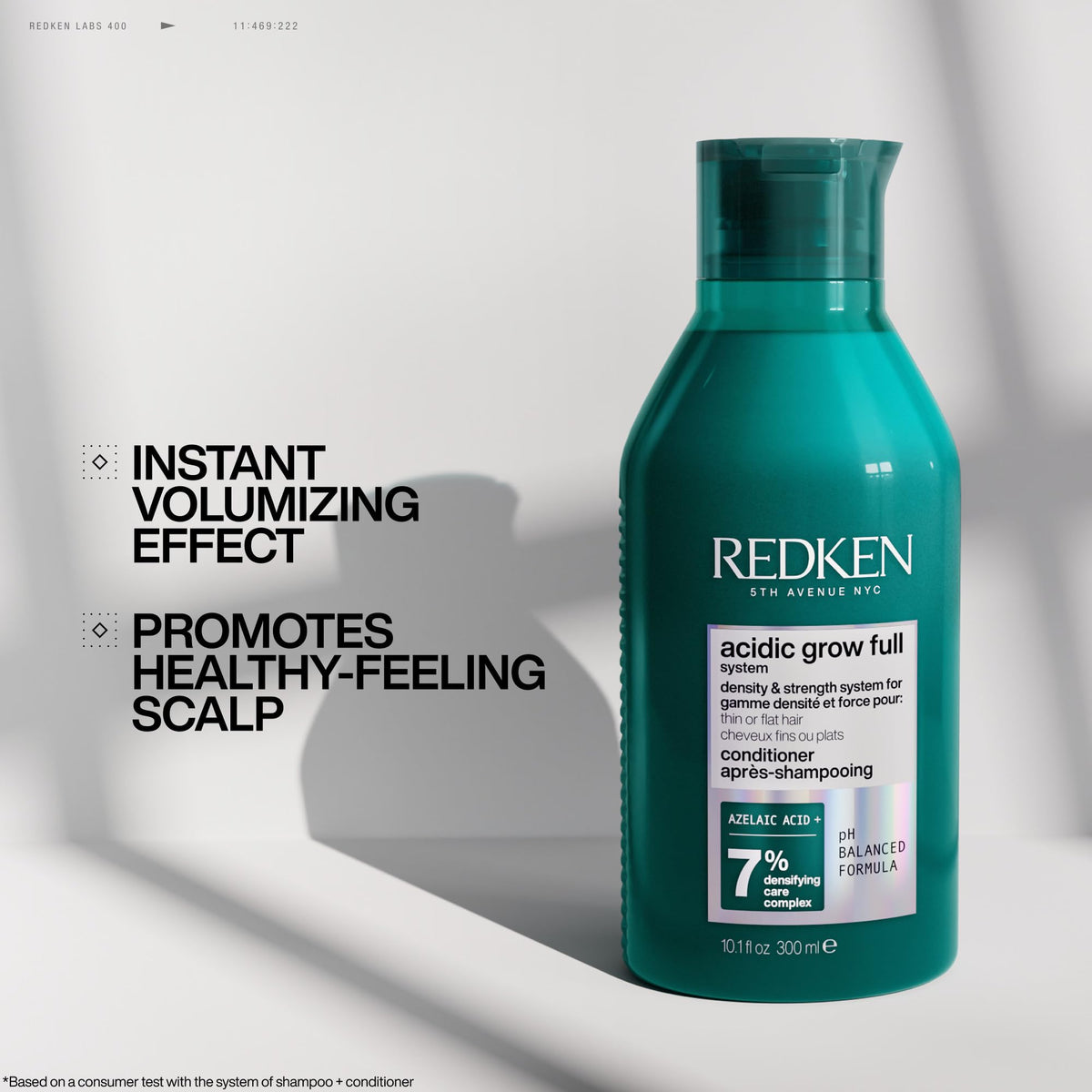 Redken bottle held in hand to show 10.1 fl oz scale and portability benefit
