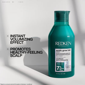 Redken bottle held in hand to show 10.1 fl oz scale and portability benefit