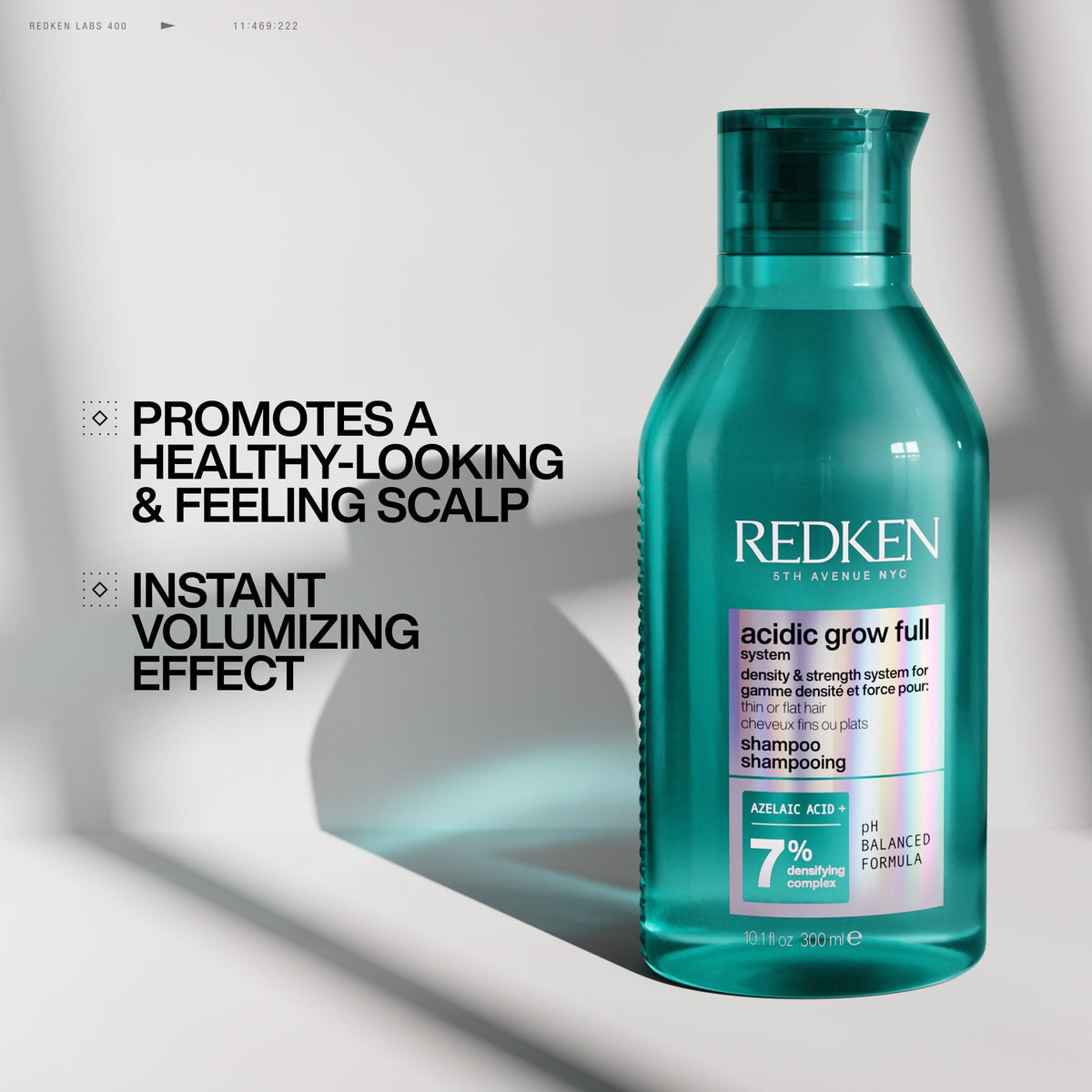 Redken shampoo foaming in hair during wash, demonstrates lightweight lather and scalp care
