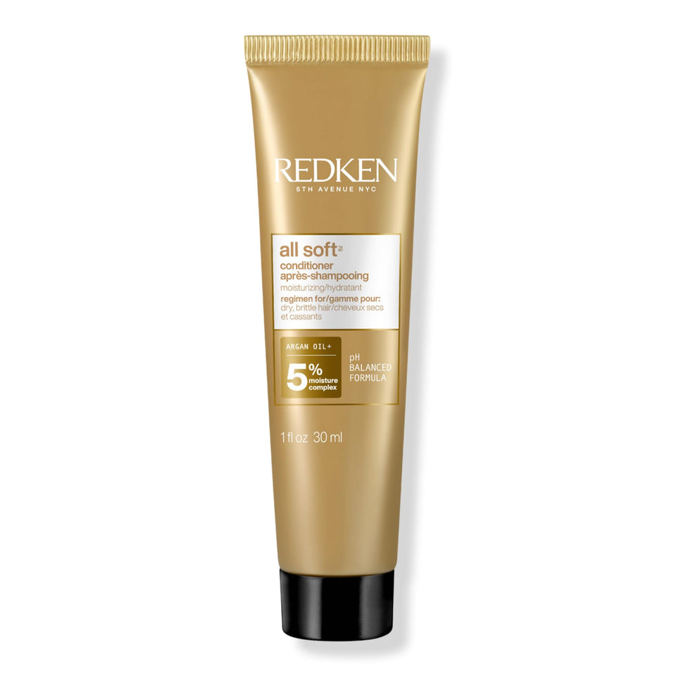 Redken bottle front travel size showing brand and moisturizing benefit