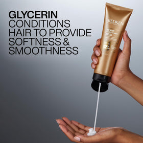 redken jar next to hand for scale helping shoppers visualize actual product size