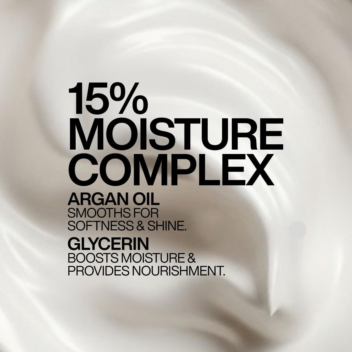 Redken All Soft mask applied to mid-lengths demonstrating frizz control benefit