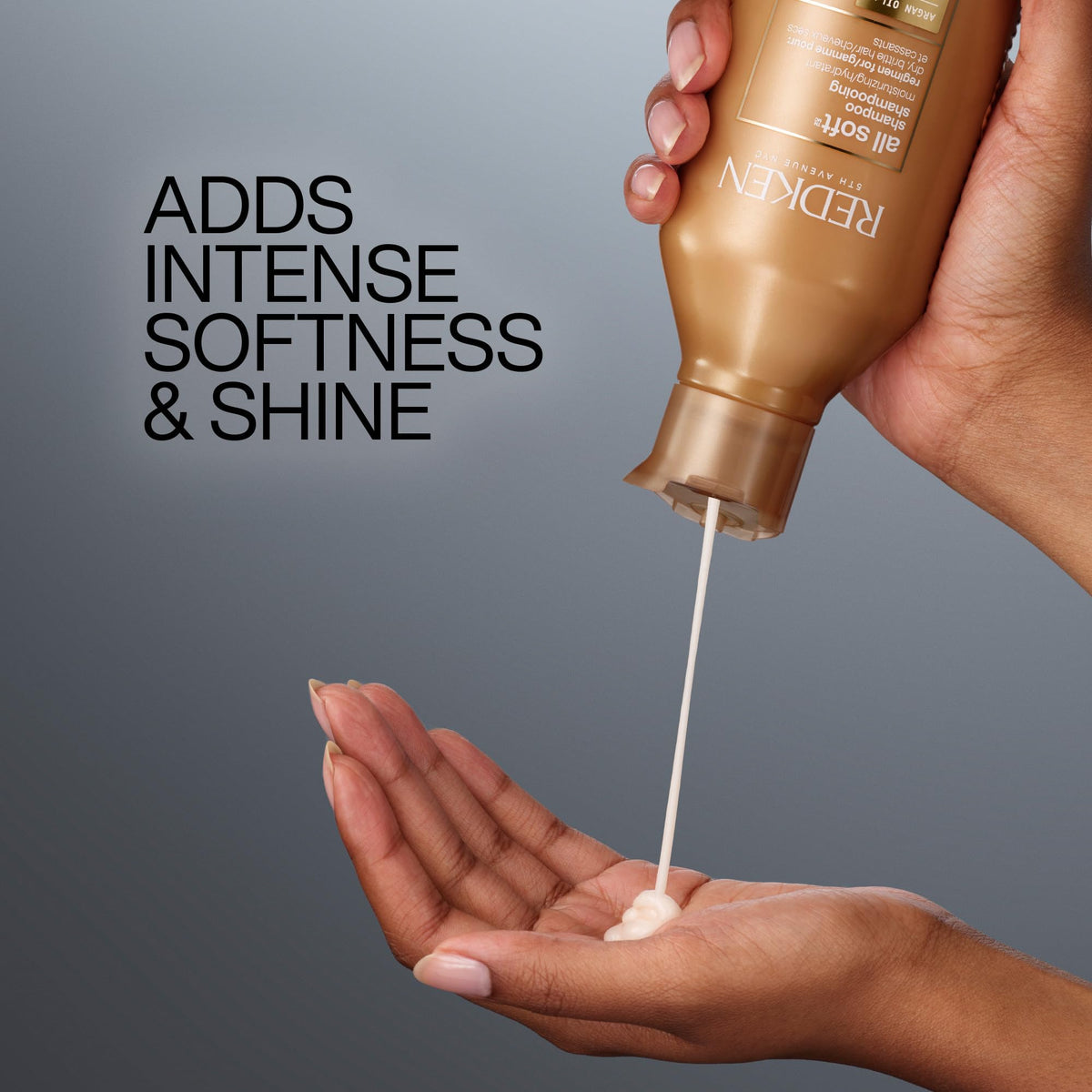Redken All Soft shampoo held in hand showing bottle size and travel-friendly scale